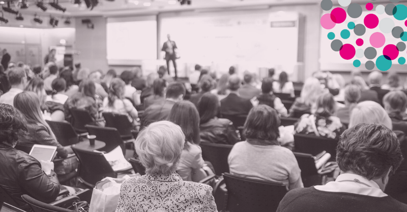 People at a marketing conference with The Marketing Centre logo superimposed